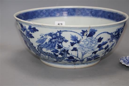A large Chinese blue and white bowl, 29.5cm a prunus jar, height 12cm and a Kangxi blue and white fluted saucer, 11cm